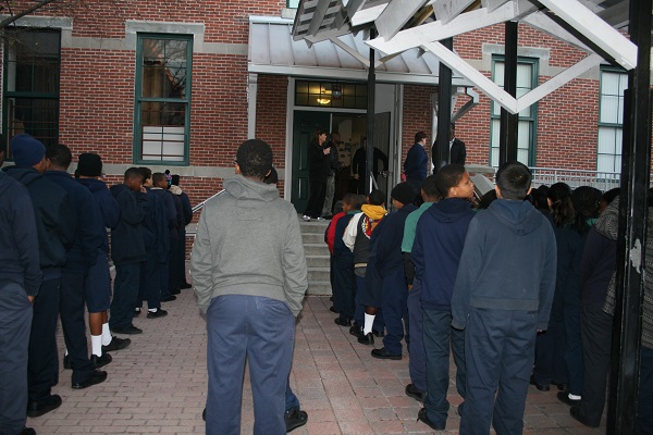Students at Academy Prep Center of Tampa line up outside each morning before shaking hands with one of the school's administrators.
