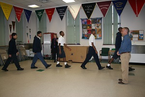Academy Prep students gather each morning inside the school before the start of the school day - like a family.