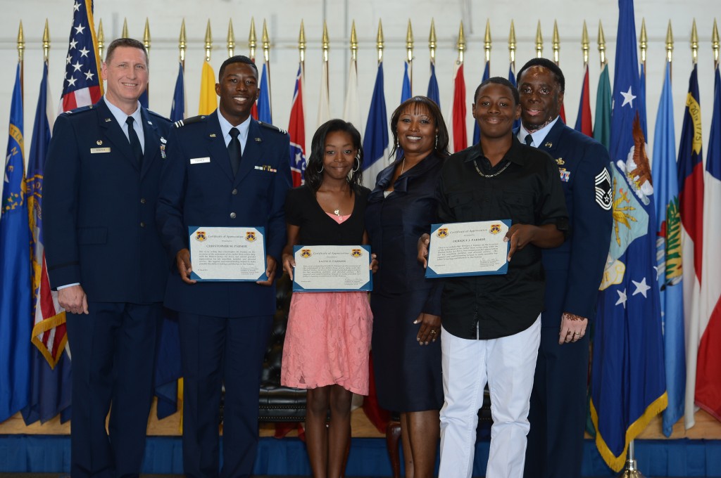 Greg Parmer, far right, poses with his family recently at MacDill Air Force Base. Parmer is among supporters of a proposed charter school on the base. PHOTO provided by family.