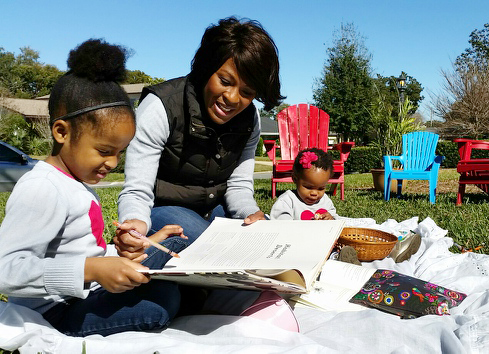 Tamsin Thomas homeschools her daughter Olivia, 5, while sister Ona, 1, sits close by. “I don’t want my daughter to be short-changed because of the color of her skin,” Thomas said of Olivia. “I feel like I’m the only one who has her best interests at heart.” (Photo courtesy of Tamsin Thomas)