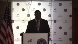 Raushaun WIlliams addresses school choice advocates during a reception at the Democratic National Convention.
